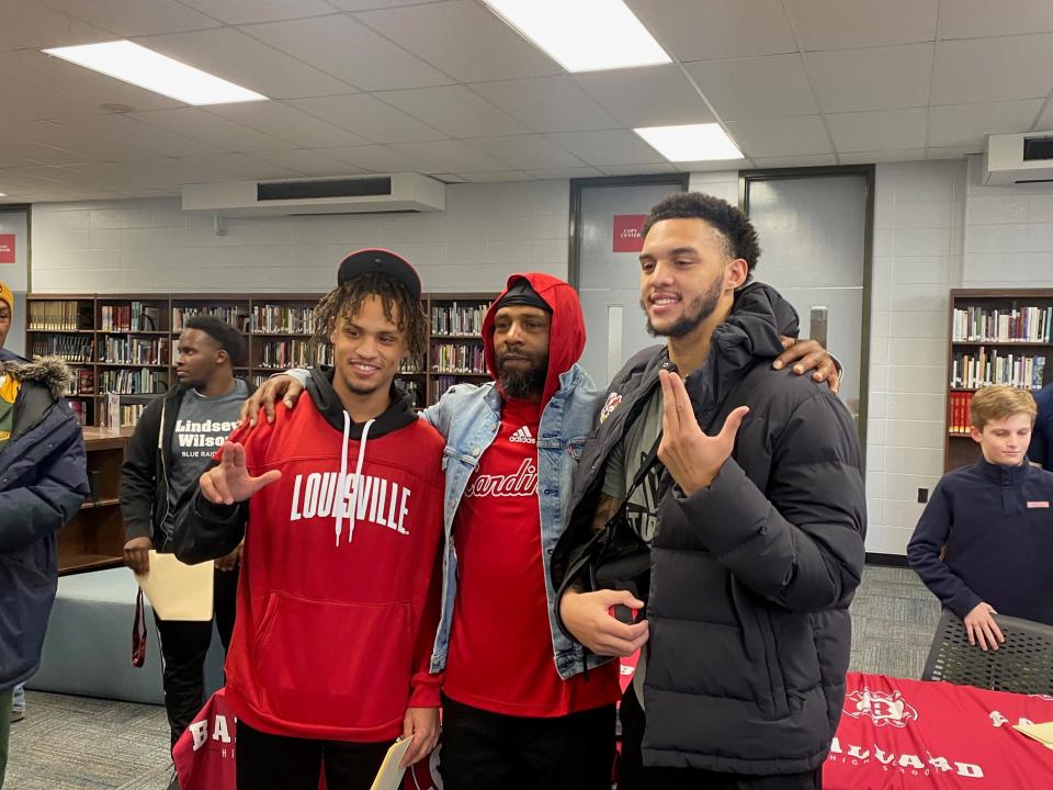 Jaden Minkins, left, poses for a picture with his father, Josh Minkins Sr., and older brother, Josh Minkins Jr., on Wednesday, Feb. 1, 2023 at Ballard High School in Louisville, Ky. Minkins has signed to play football at the University of Louisville as a preferred walk-on.