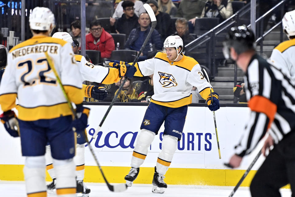 Nashville Predators defenseman Jeremy Lauzon (3) reacts after scoring against the Vegas Golden Knights during the first period of an NHL hockey game Saturday, Dec. 31, 2022, in Las Vegas. (AP Photo/David Becker)