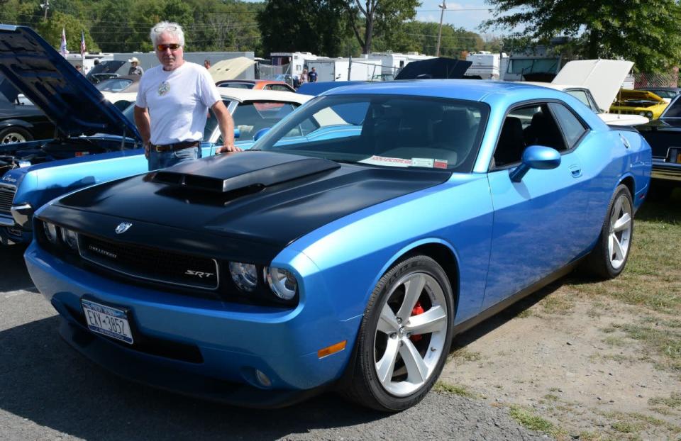 <p>This Challenger may look stock-ish, but his bored, stroked and blown Hemi sends about 700 hp to the rear wheels.<br></p>