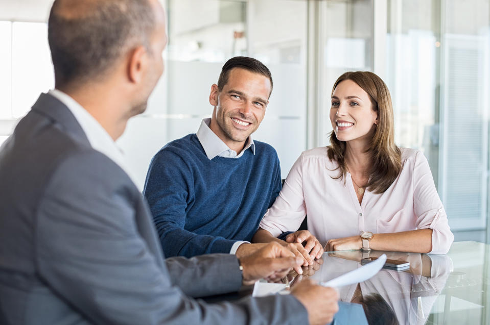 A banker meets with clients.