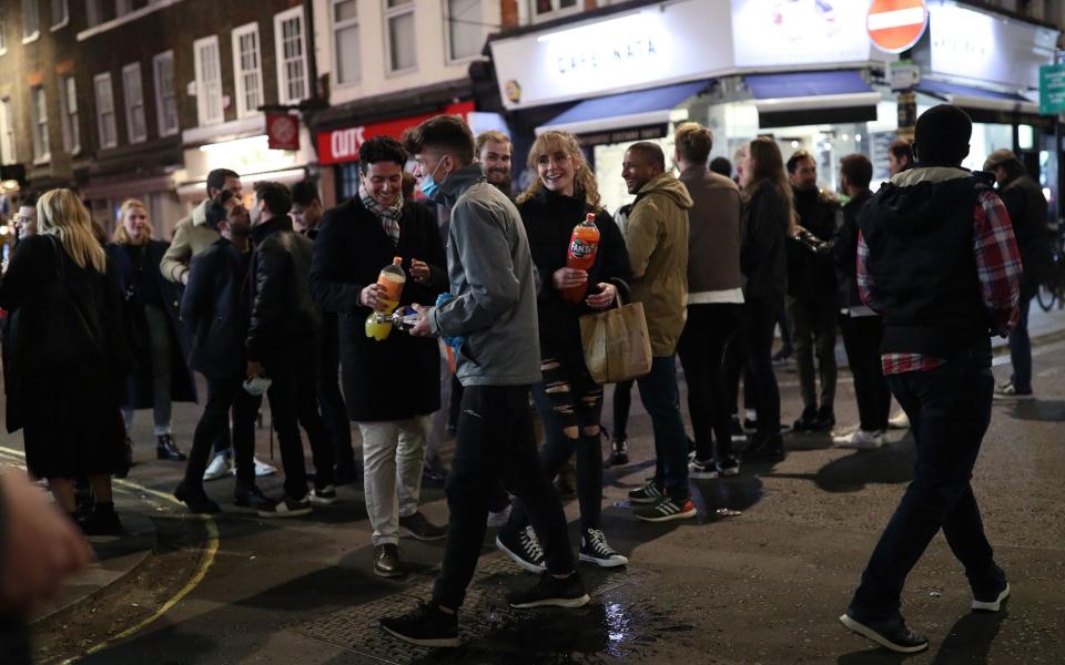 People on the streets of Soho, central London, after the pub and restaurant curfew on Saturday night - Yui Mok/PA