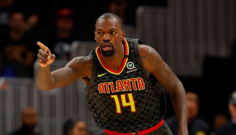 ATLANTA, GEORGIA - FEBRUARY 09: Dewayne Dedmon #14 of the Atlanta Hawks reacts after dunking against the New York Knicks in the first half at State Farm Arena on February 09, 2020 in Atlanta, Georgia. NOTE TO USER: User expressly acknowledges and agrees that, by downloading and/or using this photograph, user is consenting to the terms and conditions of the Getty Images License Agreement.