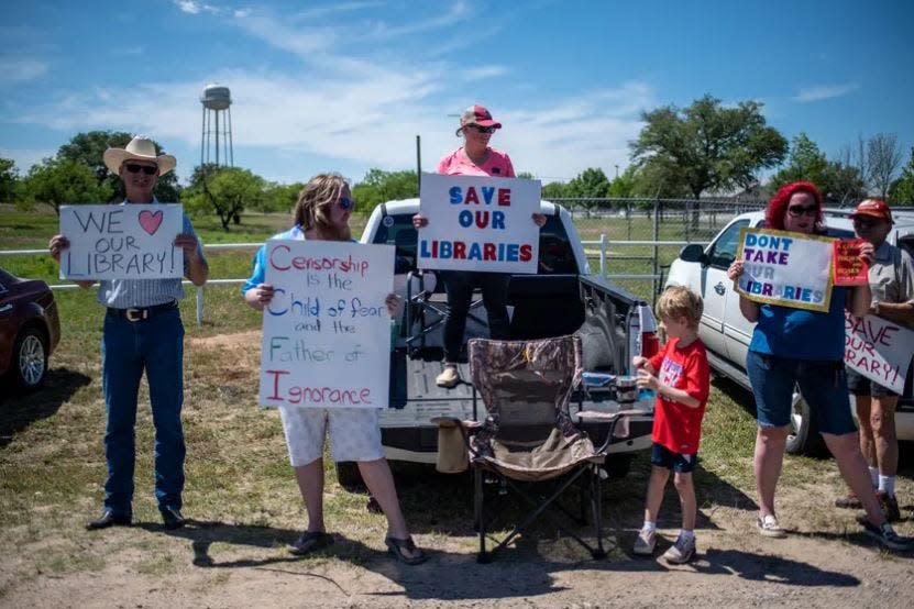 Protesters outside the Llano County Sheriff's office in April. County officials are embroiled in a lawsuit over materials pulled from county libraries.