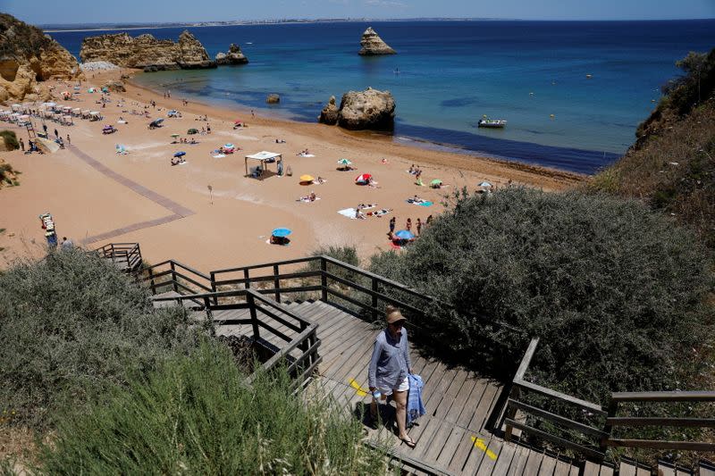 FILE PHOTO: A person leaves Dona Ana beach in Lagos