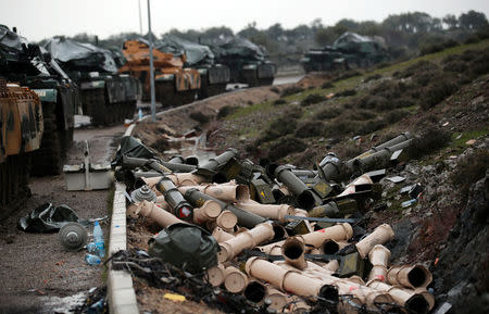 Empty shells are seen next to Turkish army tanks on the Turkish-Syrian border in Hatay province, Turkey January 23, 2018. REUTERS/Umit Bektas