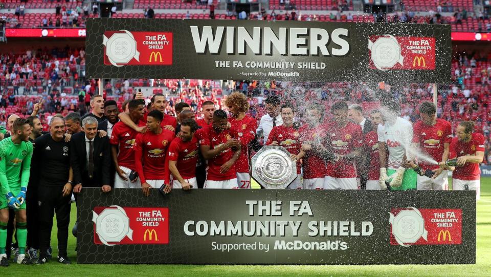 Football Soccer Britain - Leicester City v Manchester United - FA Community Shield - Wembley Stadium - 7/8/16 Manchester United celebrate with the trophy after winning the FA Community Shield Reuters / Eddie Keogh Livepic EDITORIAL USE ONLY. No use with unauthorized audio, video, data, fixture lists, club/league logos or "live" services. Online in-match use limited to 45 images, no video emulation. No use in betting, games or single club/league/player publications. Please contact your account representative for further details.