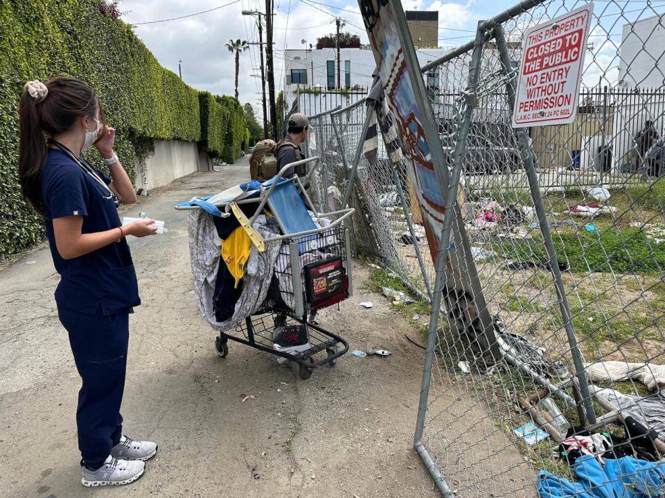 PHOTO: Healthcare in Action's Isabelle Peng searches for her homeless patients in West Hollywood.  (Angela Hart/KFF Health News)