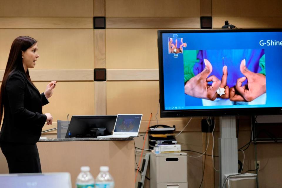 Asst. State Attorney Kristine Bradley shows a photograph of an alleged gang sign as she gives her closing argument in the trial of Jamell Demons, better known as rapper YNW Melly, at the Broward County Courthouse in Fort Lauderdale on Thursday, July 20, 2023. Demons, 22, is accused of killing two fellow rappers and conspiring to make it look like a drive-by shooting in October 2018. (Amy Beth Bennett / South Florida Sun Sentinel)