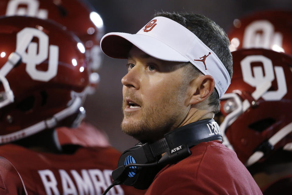 FILE - In this Saturday, Nov. 9, 2019 file photo, Oklahoma head coach Lincoln Riley talks with players during an NCAA college football game between Iowa State and Oklahoma in Norman, Okla. As usual, Riley is taking his time naming a starting quarterback. (AP Photo/Sue Ogrocki, File)