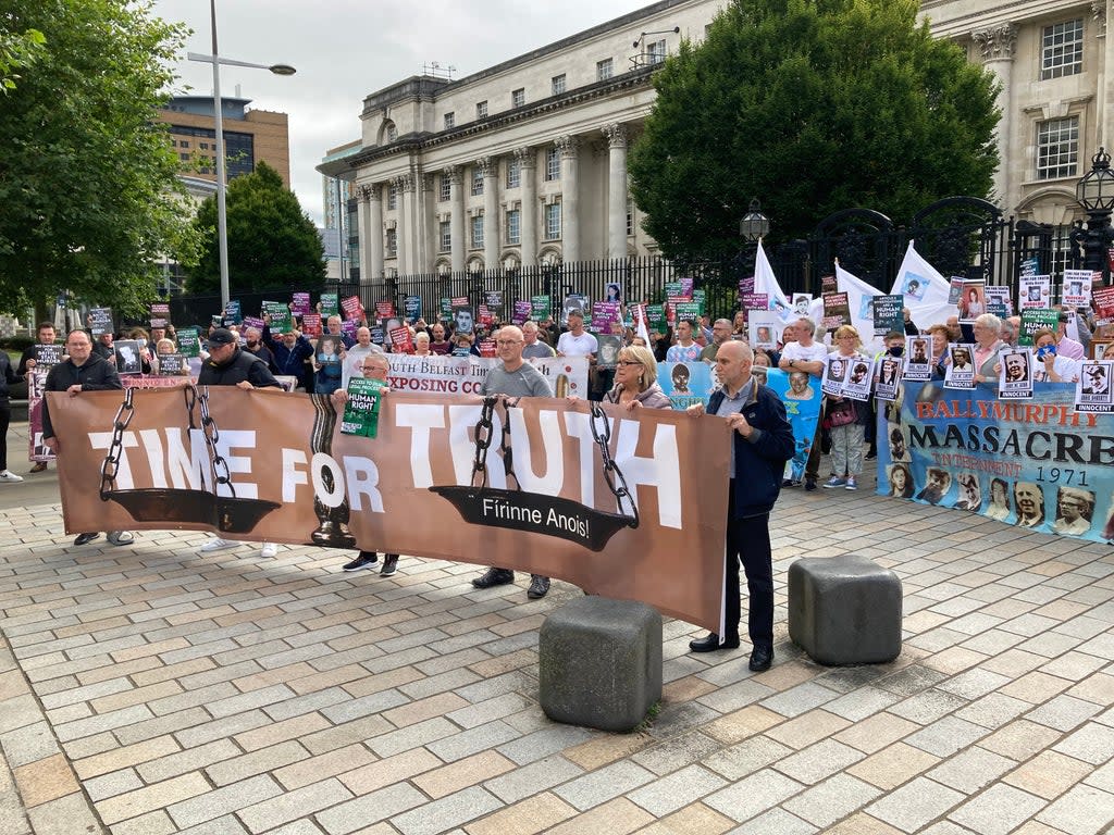 Bereaved families stage a demonstration outside the courts in Belfast (Rebecca Black/PA)