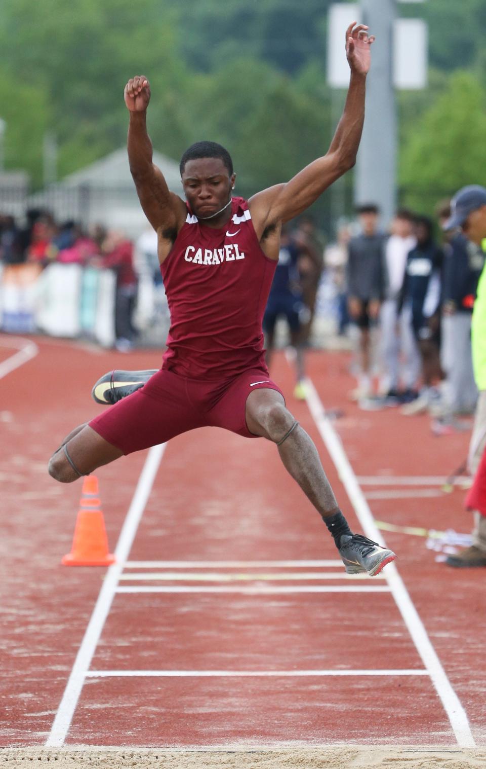 Caravel's Vandrick Hamlin leaps en route to winning the Division II triple jump during the second day of the DIAA state high school track and field championships at Dover High School, Saturday, May 18, 2024.
