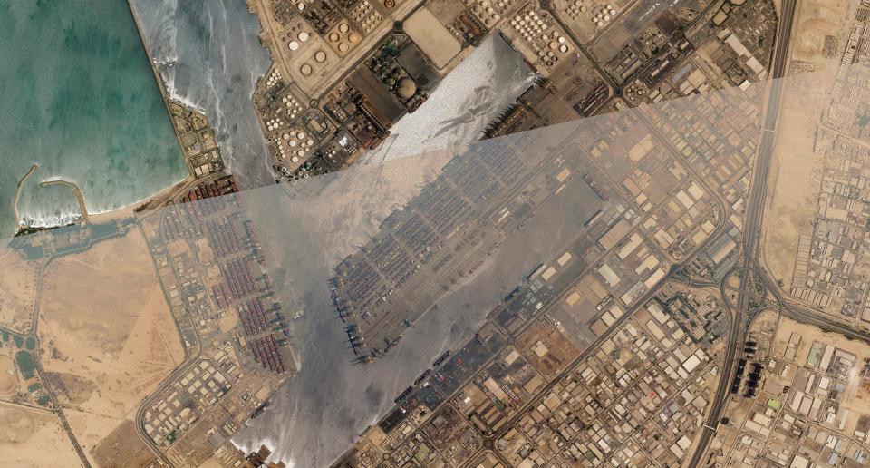 In this satellite photo shot by Planet Labs Inc., the Jebel Ali Port is seen early Thursday, July 8, 2021, in Dubai, United Arab Emirates. A fiery explosion erupted on a container ship anchored in Dubai at one of the world's largest ports late Wednesday, July 7 authorities said, sending tremors across the commercial hub of the United Arab Emirates. (Planet Labs Inc. via AP)