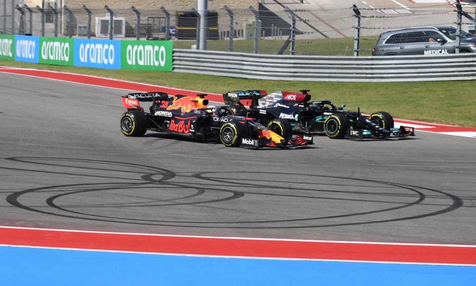 Red Bull's Dutch driver Max Verstappen (L) and Mercedes' British driver Lewis Hamilton (R) lead racers at the start of the Formula One United States Grand Prix at the Circuit of The Americas in Austin, Texas