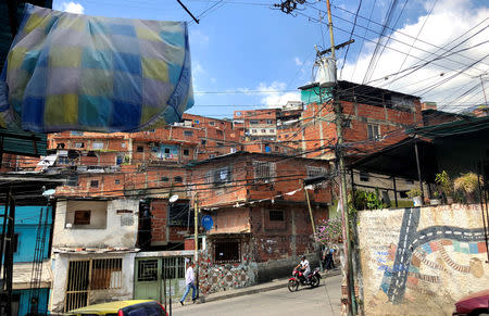 A man walks along a street at Jose Felix Ribas neighborhood in Caracas, Venezuela January 30, 2019. REUTERS/Angus Berwick