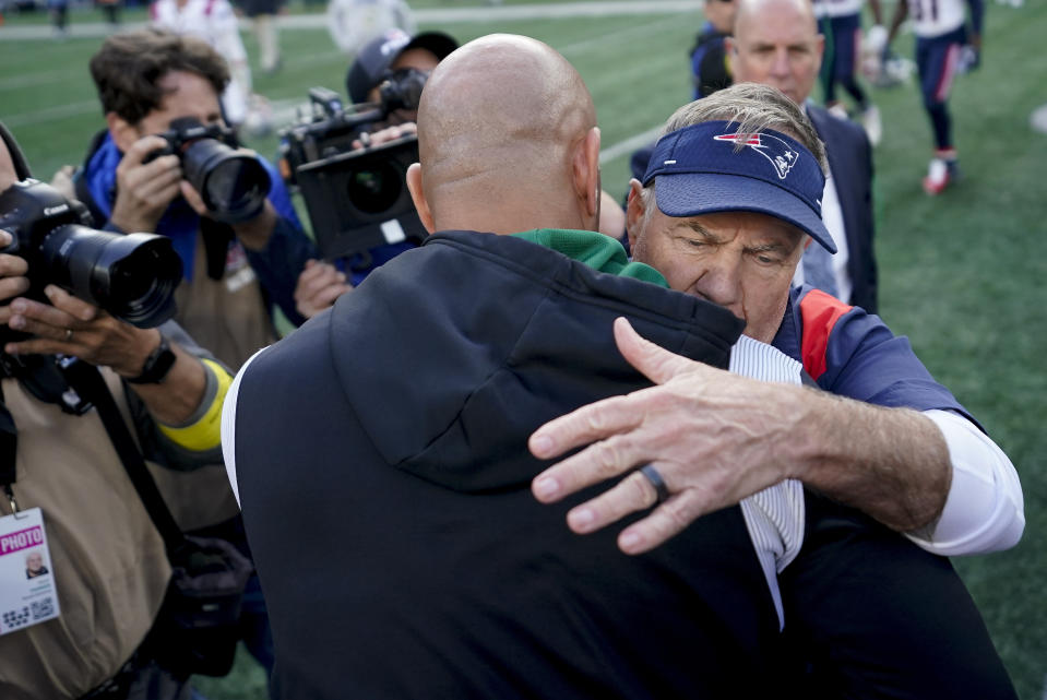 New England Patriots head coach Bill Belichick, right, greets New York Jets head coach Robert Saleh on the field after the Patriots beat the Jets 22-17 in an NFL football game, Sunday, Oct. 30, 2022, in New York. (AP Photo/John Minchillo)