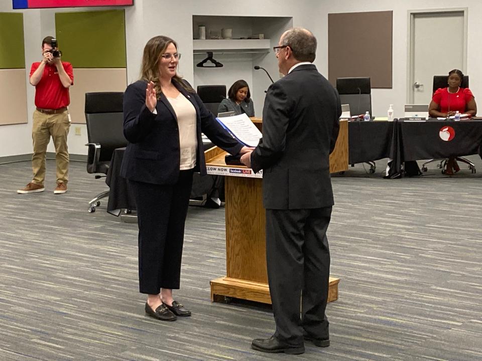 New Columbus City school board member Sarah Ingles is sworn in by Judge David Leland of the 10th Ohio District (Franklin County) Court of Appeals at the Jan. 9, 2024, board meeting.