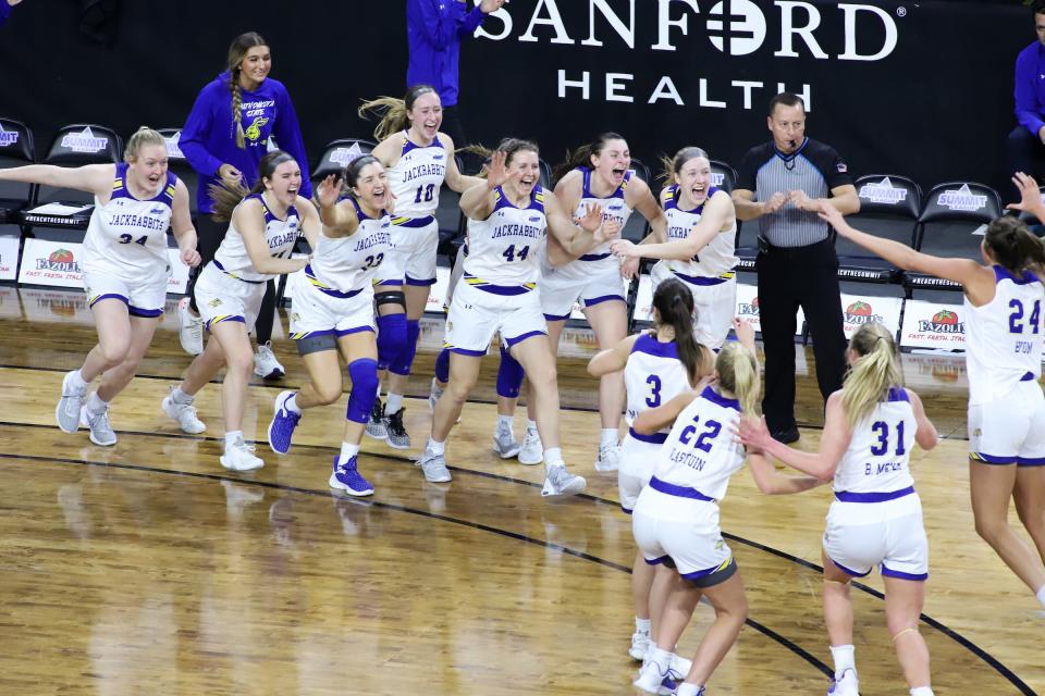 SIOUX FALLS, SD - MARCH 7: The South Dakota State Jackrabbits storm the court at the buzzer against the Omaha Mavericks at the 2023 Summit League Basketball Championship at the Denny Sanford Premier Center in Sioux Falls, South Dakota. The Jackrabbits won 93-51 to advance to the NCAA Tournament. (Photo by Miranda Sampson/Inertia)