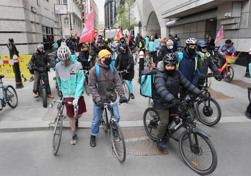 <p>Deliveroo riders from the Independent Workers' Union of Great Britain (IWGB) in the City of London, as they go on strike in a dispute for fair pay, safety protections and basic workers' rights. Picture date: Wednesday April 7, 2021.</p>
