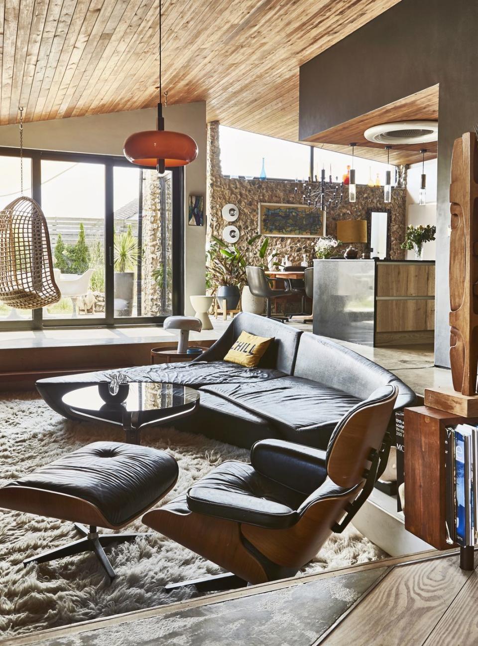 living room with a black sofa and chair