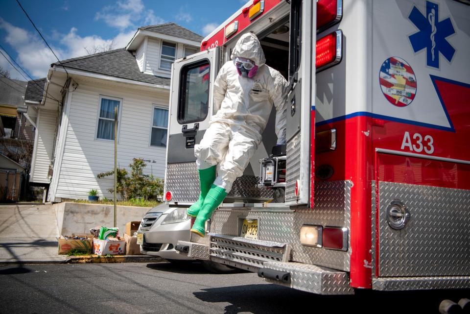 The Paterson fire department COVID-19 EMS unit responds to a call for a person under investigation of having the coronavirus on April 16, 2020. Paterson has one of the highest coronavirus caseloads in New Jersey, with about 3,000 residents testing positive, according to state health officials.