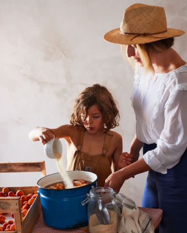 <p>Aubrie Pick</p> Copeland and her son, Mátyás, adding sugar to fresh local apricots to cook down into sÃ¡rgabarack lekvÃ¡r.