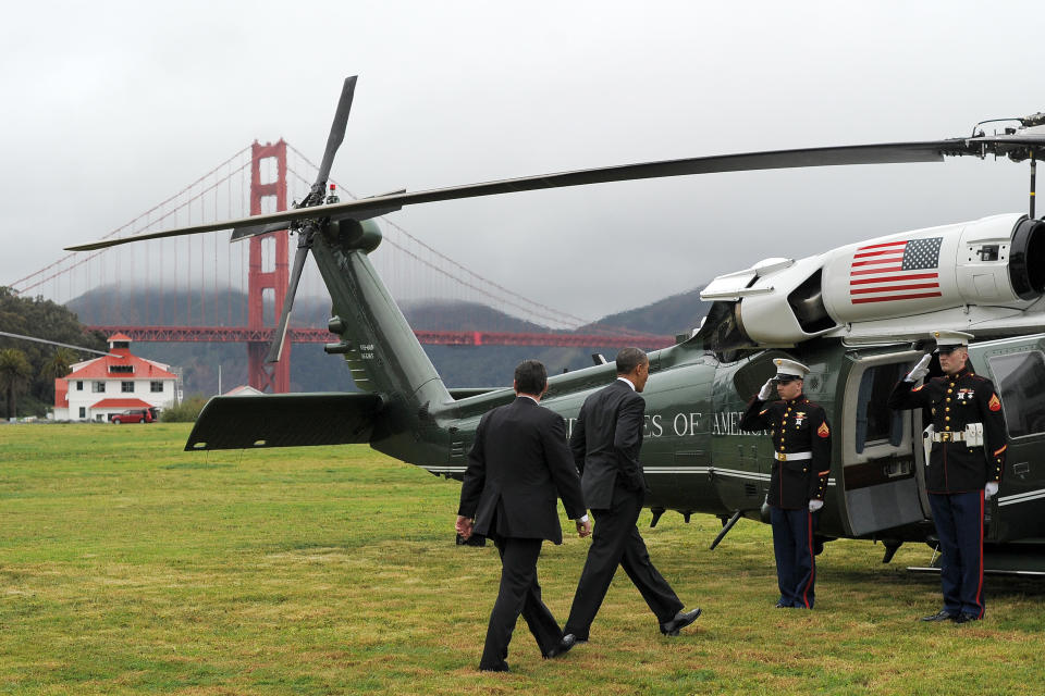 US President Barack Obama boards Marine One helicopter from a field overlooking the iconic golden gate bridge in San Francisco, California, on April 4, 2013. Obama is in California to attend two DCCC fund rising events. AFP PHOTO/Jewel Samad       