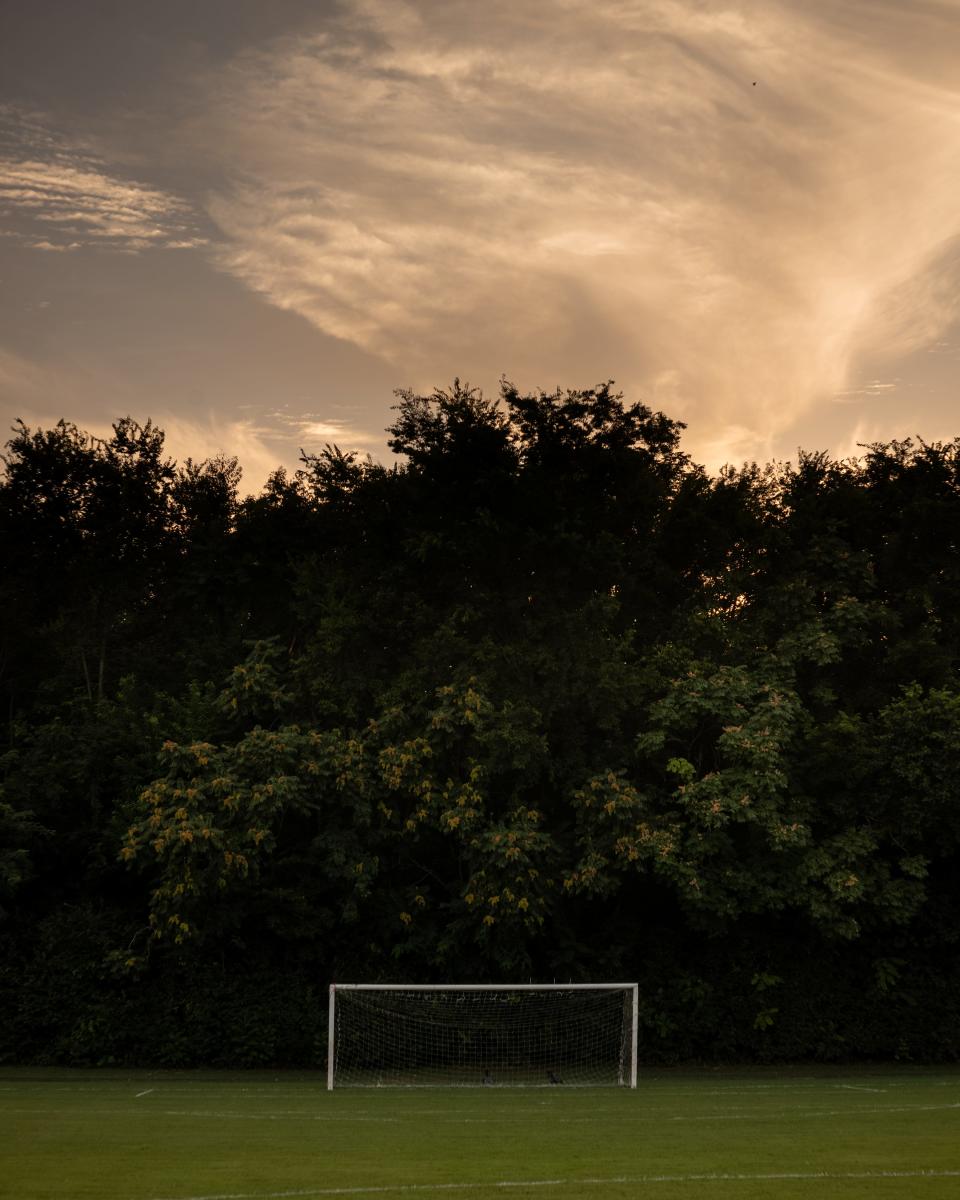 The sun sets over a soccer field in Franklin, Tenn., Wednesday, Aug. 2, 2023.