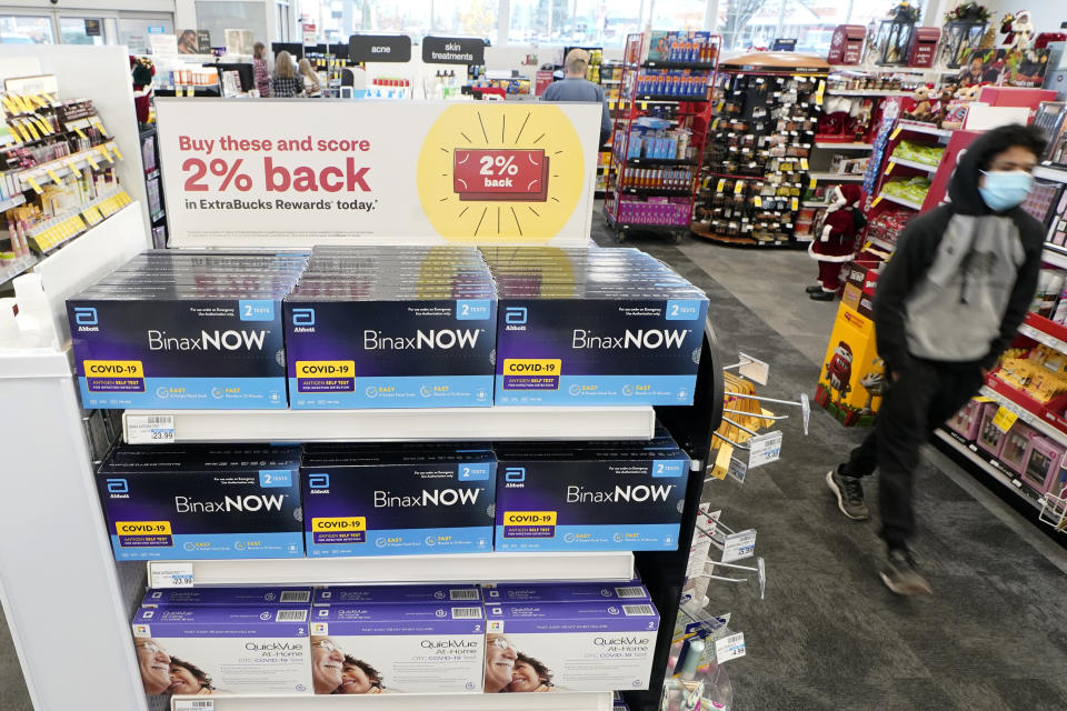 Boxes of BinaxNow home COVID-19 tests made by Abbott and QuickVue home tests made by Quidel are shown for sale Monday, Nov. 15, 2021, at a CVS store in Lakewood, Wash., south of Seattle. After weeks of shortages, retailers like CVS say they now have ample supplies of rapid COVID-19 test kits, but experts are bracing to see whether it will be enough as Americans gather for Thanksgiving and new outbreaks spark across the Northern and Western states. (AP Photo/Ted S. Warren)