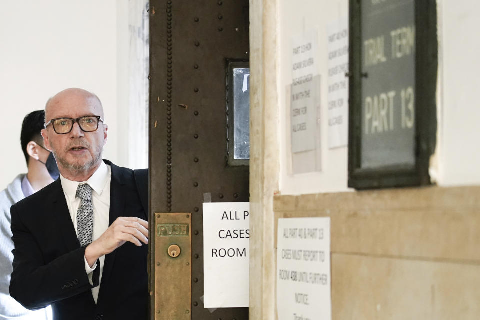 Film director Paul Haggis exits the courtroom for a lunch break, Wednesday, Oct. 19, 2022, in New York. Jurors are getting their first look at a lawsuit that pits Oscar-winning moviemaker Haggis against a publicist who alleges that he raped her. He says their 2013 encounter was consensual. (AP Photo/Julia Nikhinson)