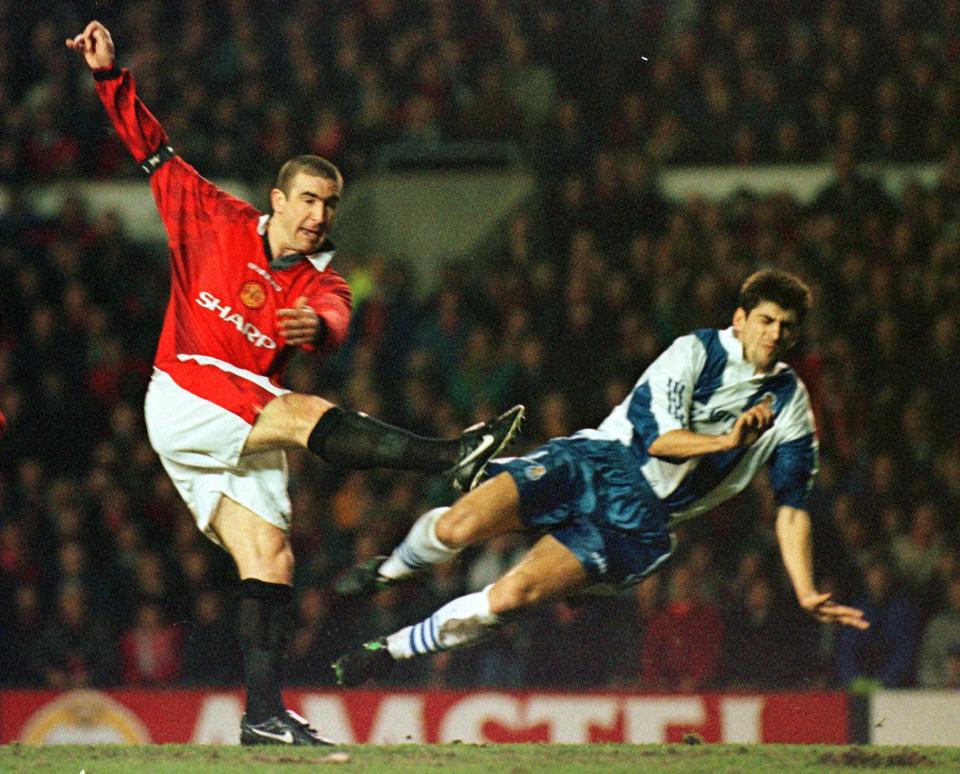 Manchester United's Eric Cantona hammers the ball past FC Porto's Alosio, to score his teams second goal, Wednesday 5 March 1997 during the UEFA Champions Cup quarterfinals 1st leg soccer match played at Old Trafford in Manchester. Manchester United won the match 4-0. (AP Photo/Max Nash)