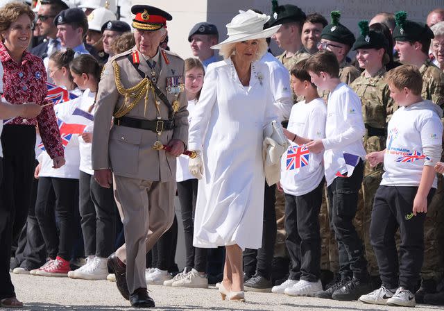 <p>GARETH FULLER/POOL/AFP via Getty</p> King Charles and Queen Camilla at the British D-Day memorial at Normandy, France on June 6, 2024.