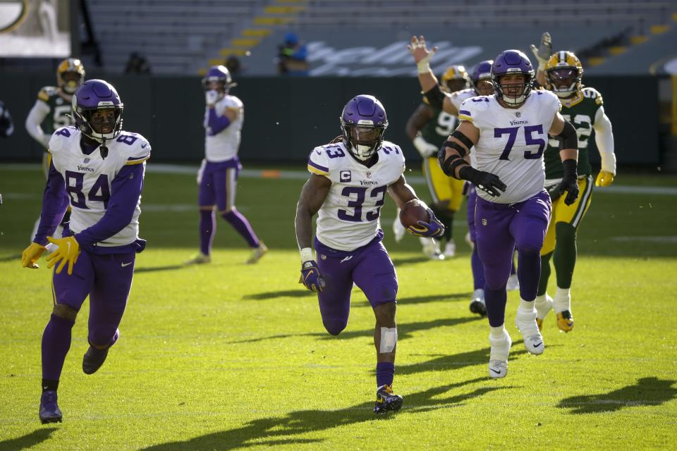 Minnesota Vikings' Dalvin Cook breaks away for a touchdown during the second half of an NFL football game against the Green Bay Packers Sunday, Nov. 1, 2020, in Green Bay, Wis. (AP Photo/Mike Roemer)