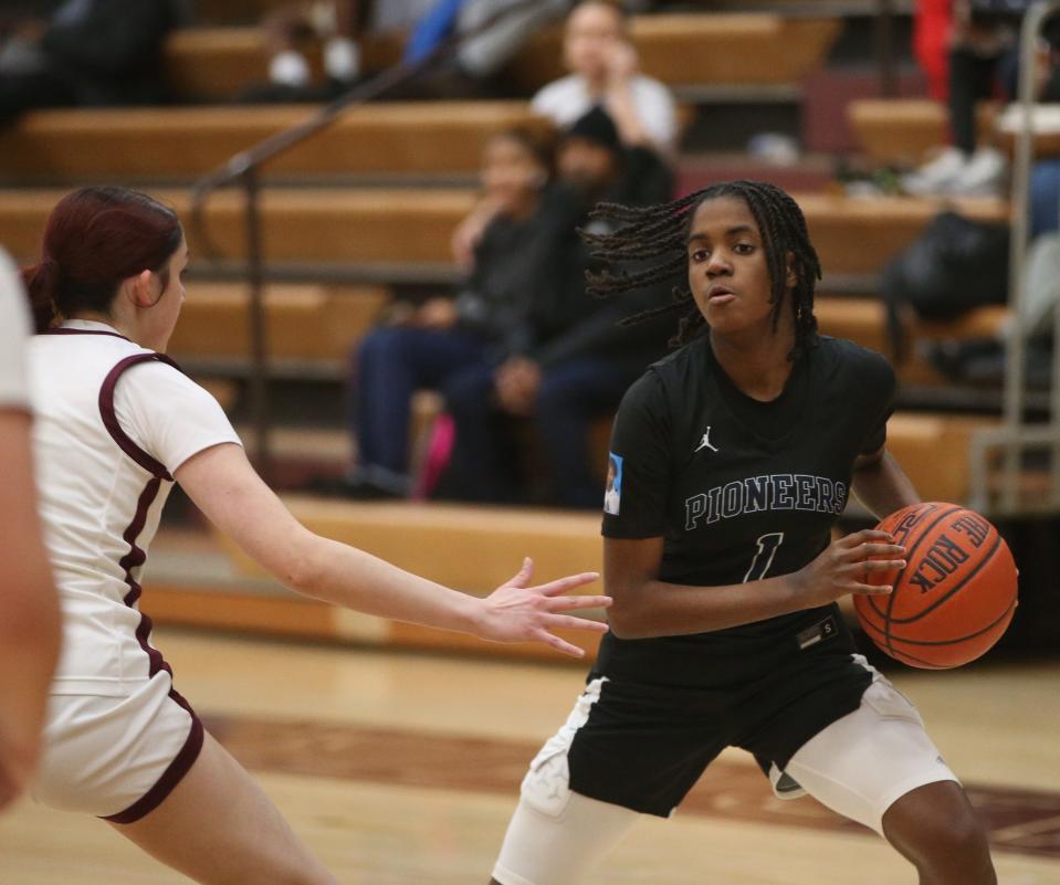 Poughkeepsie's Mahogany Felix draws away from Arlington's Deona Garcia during a game on January 31, 2024.