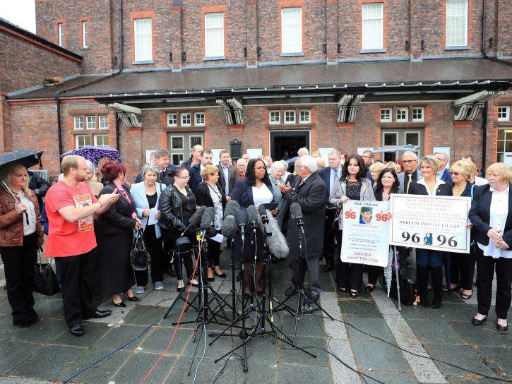 Friends and family of victims speak to the media outside Parr Hall, Warrington, where the Crown Prosecution Service said Hillsborough match commander David Duckenfield, former chief constable Sir Norman Bettison and four other individuals have been charged with offences relating to the Hillsborough disaster: Peter Byrne/PA Wire