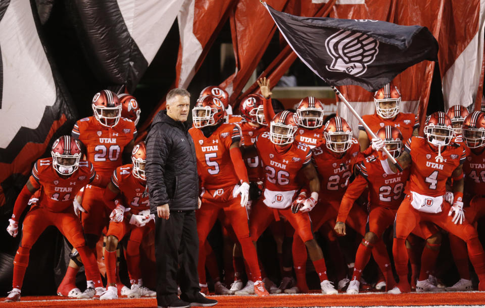 Utah head coach Kyle Whittingham and his team prepares to take the field prior to their game against the BYU during an NCAA college football game Saturday Nov. 24, 2018, in Salt Lake City. (AP Photo/Rick Bowmer)