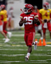 FILE - Kansas City Chiefs running back Clyde Edwards-Helaire runs the ball during NFL football training camp Wednesday, Aug. 3, 2022, in St. Joseph, Mo. Edwards-Helaire and Isiah Pacheco were drafted on opposite ends of the spectrum, one a first-round pick with high expectations and the other seventh-round selection chosen almost as an afterthought. Yet a third of the way through training camp, the two are in a heated race to be the starting running back of the Kansas City Chiefs. (AP Photo/Charlie Riedel, File)