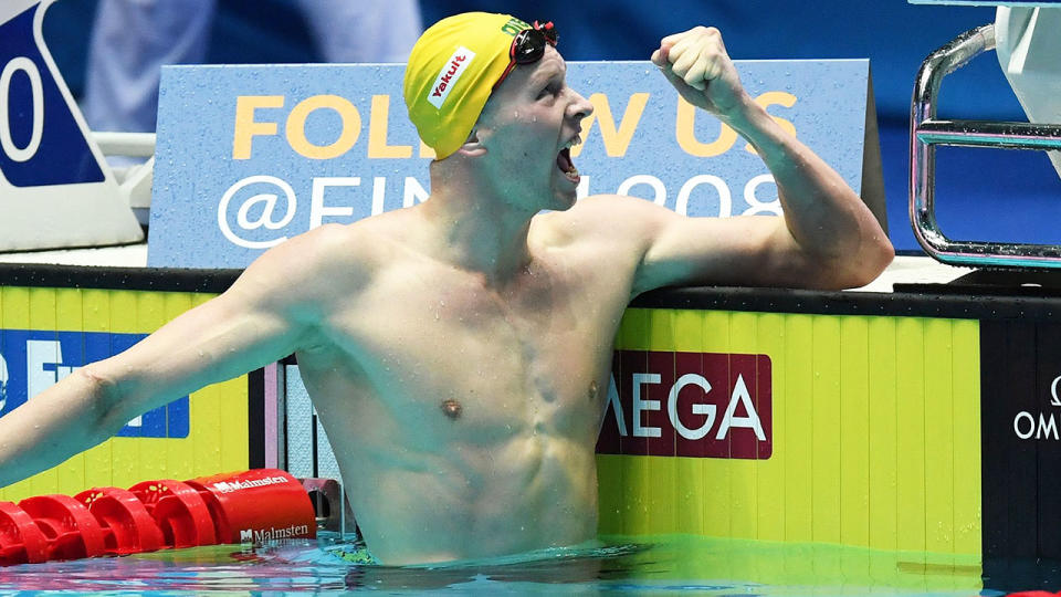 Clyde Lewis celebrates winning the semi-final of the men's 200m freestyle at the world titles. (Photo by VATSYAYANA/AFP/Getty Images)