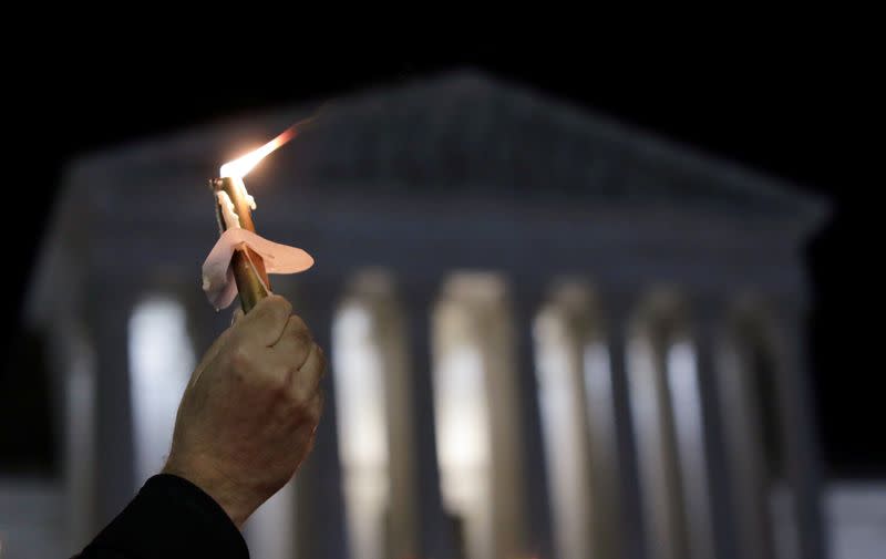 People gather for a vigil following the death of Supreme Court Justice Ruth Bader Ginsburg in Washington