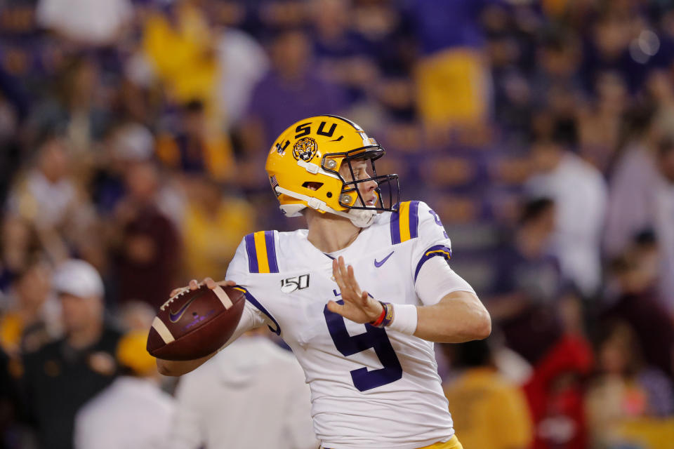 LSU quarterback Joe Burrow (9) warms up before an NCAA college football game against Texas A&M in Baton Rouge, La., Saturday, Nov. 30, 2019. (AP Photo/Gerald Herbert)