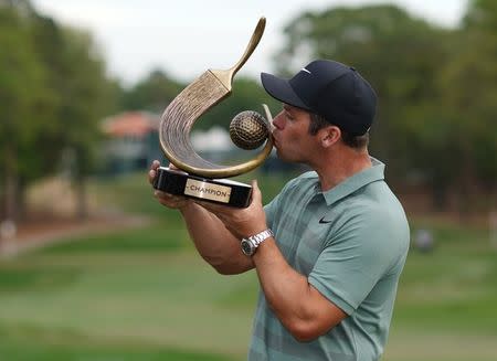 Mar 11, 2018; Palm Harbor, FL, USA; Paul Casey kisses the trophy after winning the Valspar Championship golf tournament at Innisbrook Resort - Copperhead Course. Jasen Vinlove-USA TODAY Sports