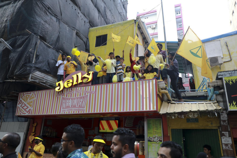 Supporters of Maldives’ former president Mohamed Nasheed, cheer upon his arrival in Maldives, Thursday, Nov.1, 2018. Nasheed, the first democratically elected president of the Maldives returned home Thursday after more than two years in exile to escape a long prison term. (AP Photo/Mohamed Sharuhaan)