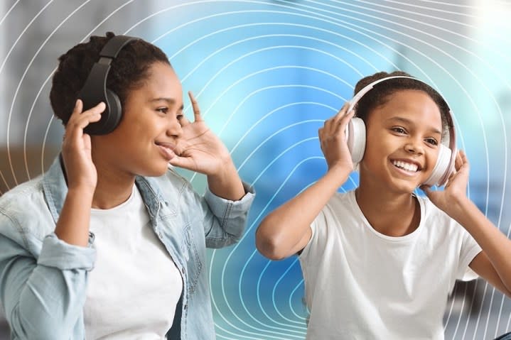 Two women listening to wireless headphones.