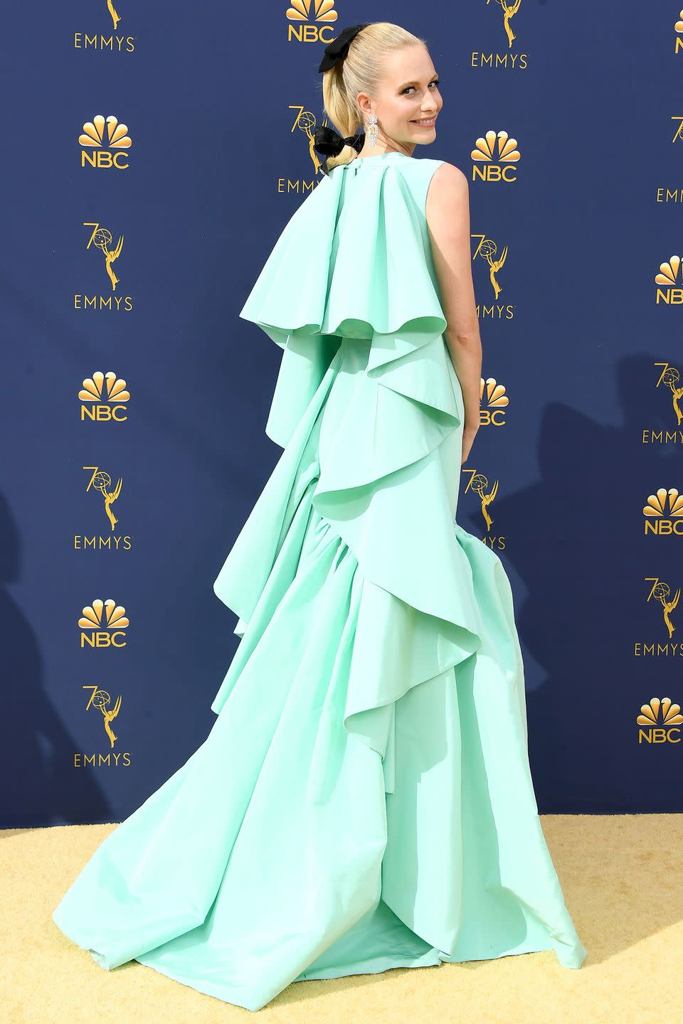 <p>Poppy Delevingne embraced the ruffle trend in a bright turquoise gown by Emilia Wickstead. She continued the girly feel of the look by adding bows into her hair and opting for statement sparkly earrings.</p>