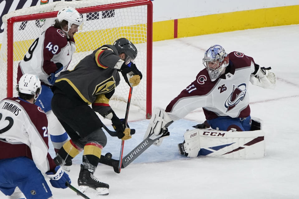 Vegas Golden Knights left wing William Carrier (28) scores a goal against Colorado Avalanche goaltender Philipp Grubauer (31) during the third period in Game 6 of an NHL hockey Stanley Cup second-round playoff series Thursday, June 10, 2021, in Las Vegas. (AP Photo/John Locher)