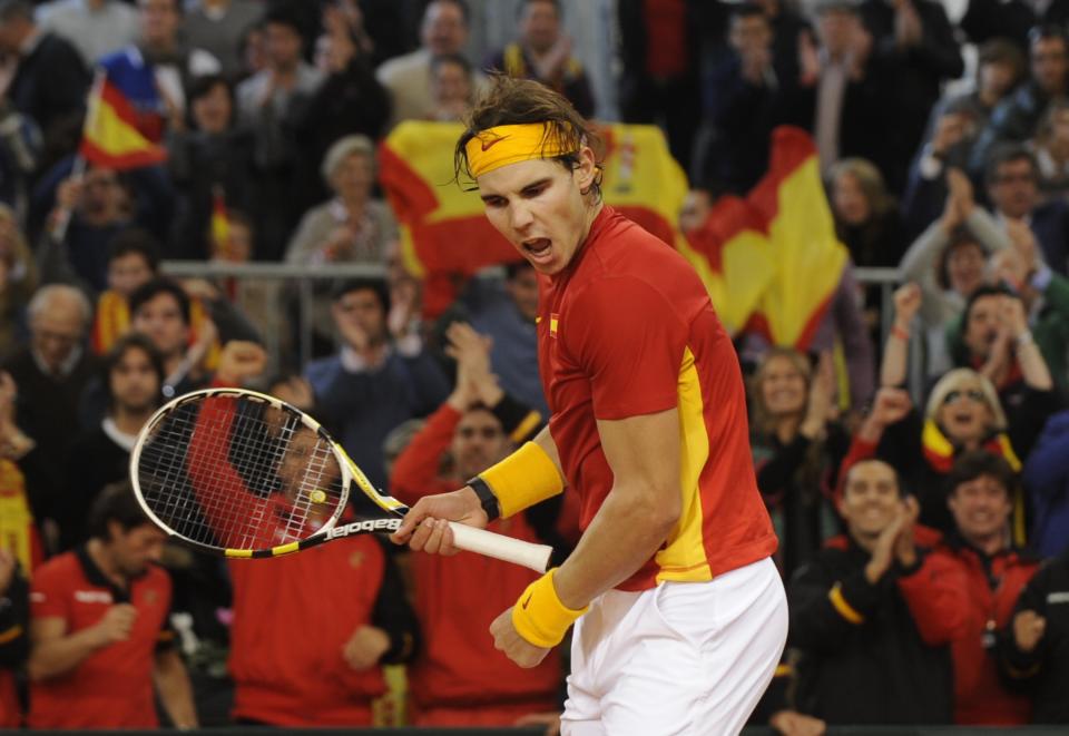 Spanish Rafael Nadal celebrates after wining the Davis Cup final first match against Argentinian Juan Monaco at La Cartuja Olympic stadium in Sevilla on December 2, 2011. Nadal won 6-1, 6-1, 6-2.  AFP PHOTO / CRISTINA QUICLER (Photo credit should read CRISTINA QUICLER/AFP/Getty Images)