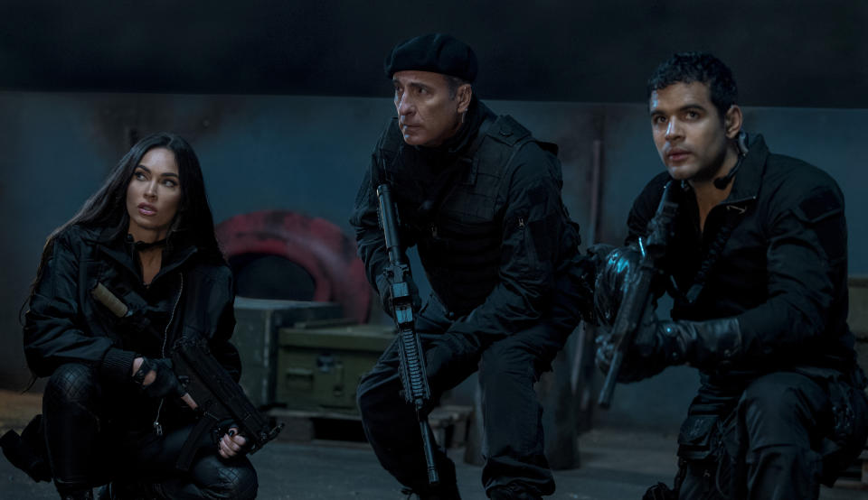 This image released by Lionsgate shows Megan Fox, from left, Andy Garcia, and Jacob Scipio in a scene from "The Expend4bles." (Yana Blajeva/Lionsgate via AP)