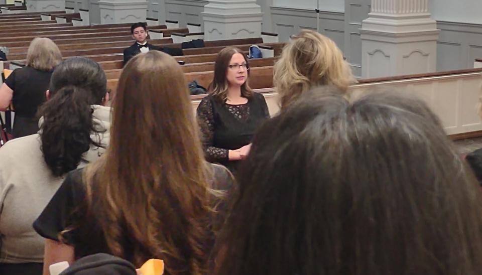 Director Ellen Peterson gives instruction to members of the Lexington Choral Society during a recent rehearsal.