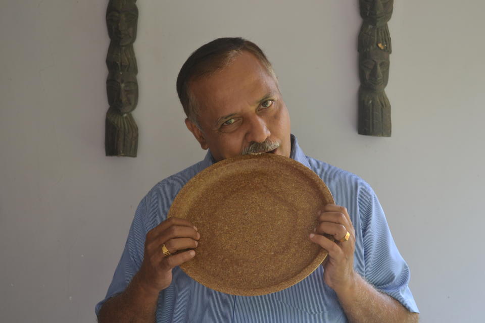 Vinaykumar testing the strength and firmness of the plate with his teeth