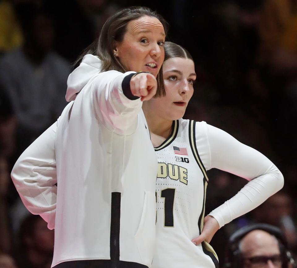 Purdue Boilermakers head coach Katie Gearlds talks to Purdue Boilermakers guard Sophie Swanson (31) during the NCAA women’s basketball game against the Iowa Hawkeyes, Wednesday, Jan. 10, 2024, at Mackey Arena in West Lafayette, Ind.