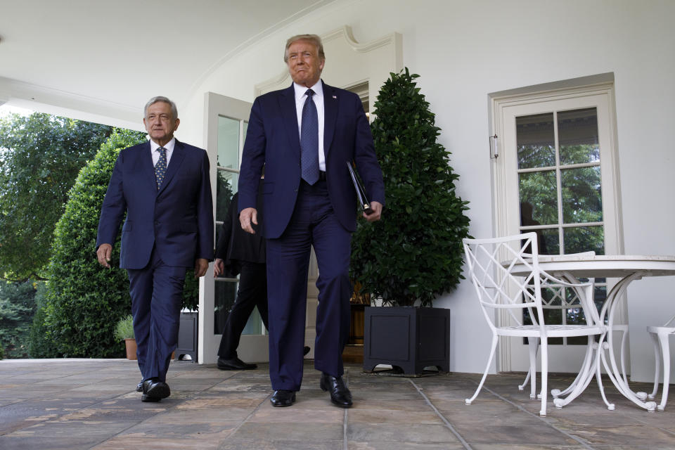 President Donald Trump and Mexican President Andres Manuel Lopez Obrador walk out of the Oval Office to deliver a statement in the Rose Garden of the White House, Wednesday, July 8, 2020, in Washington. (AP Photo/Evan Vucci)